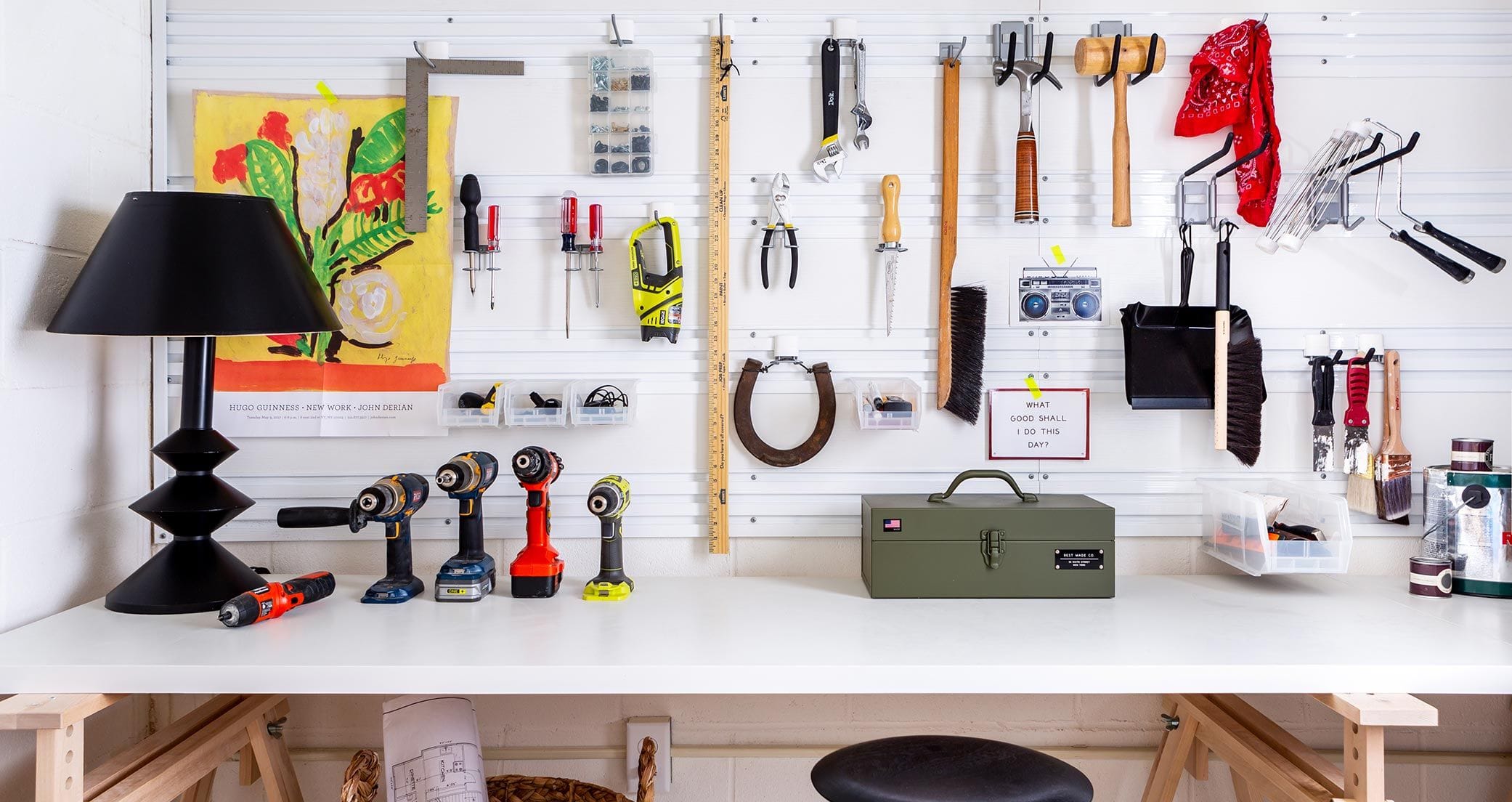 Custom garage workbench against wall with fusion wall track system by California Closets
