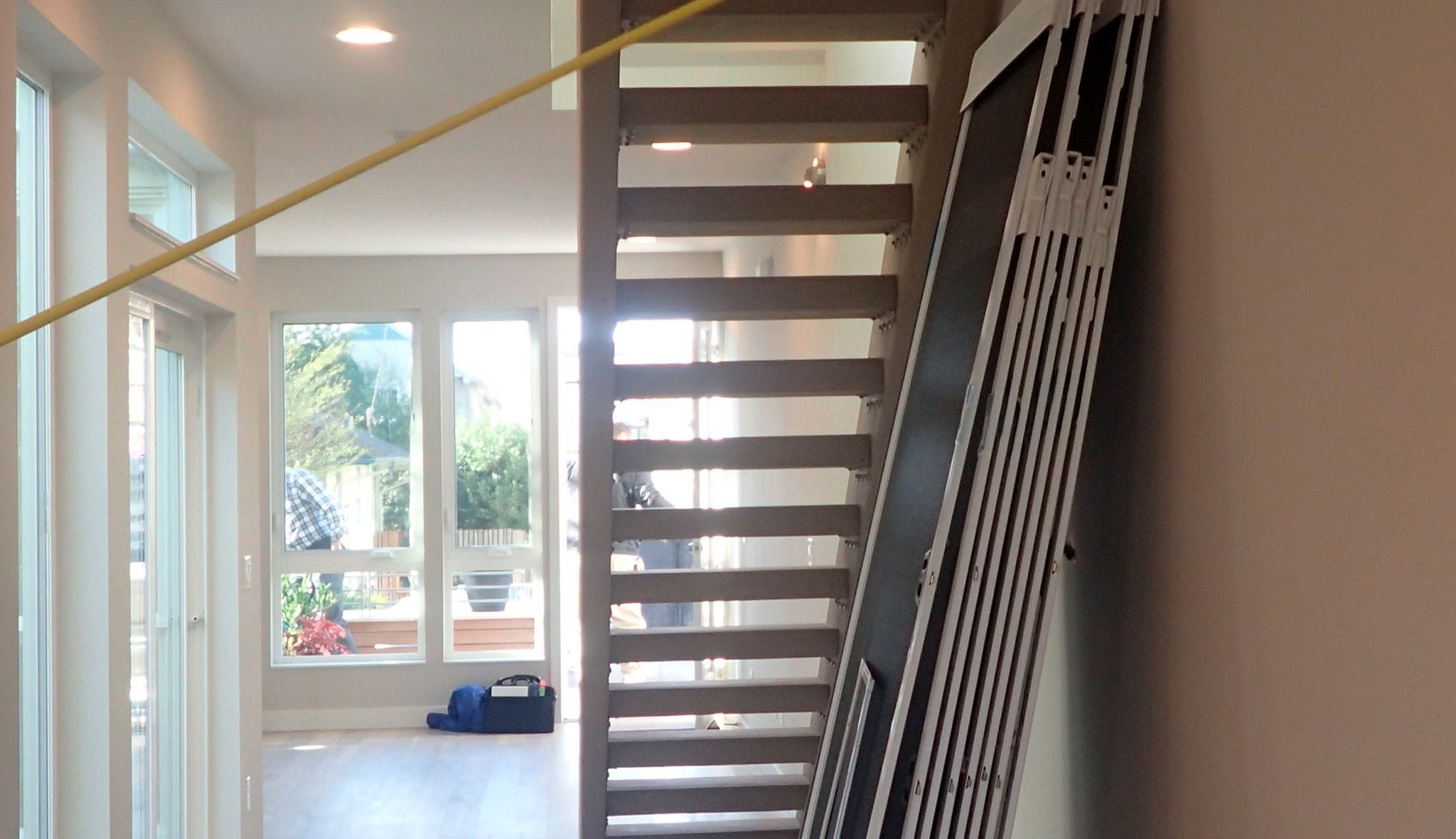 Before space remodeled under the stairs pantry design by California Closets
