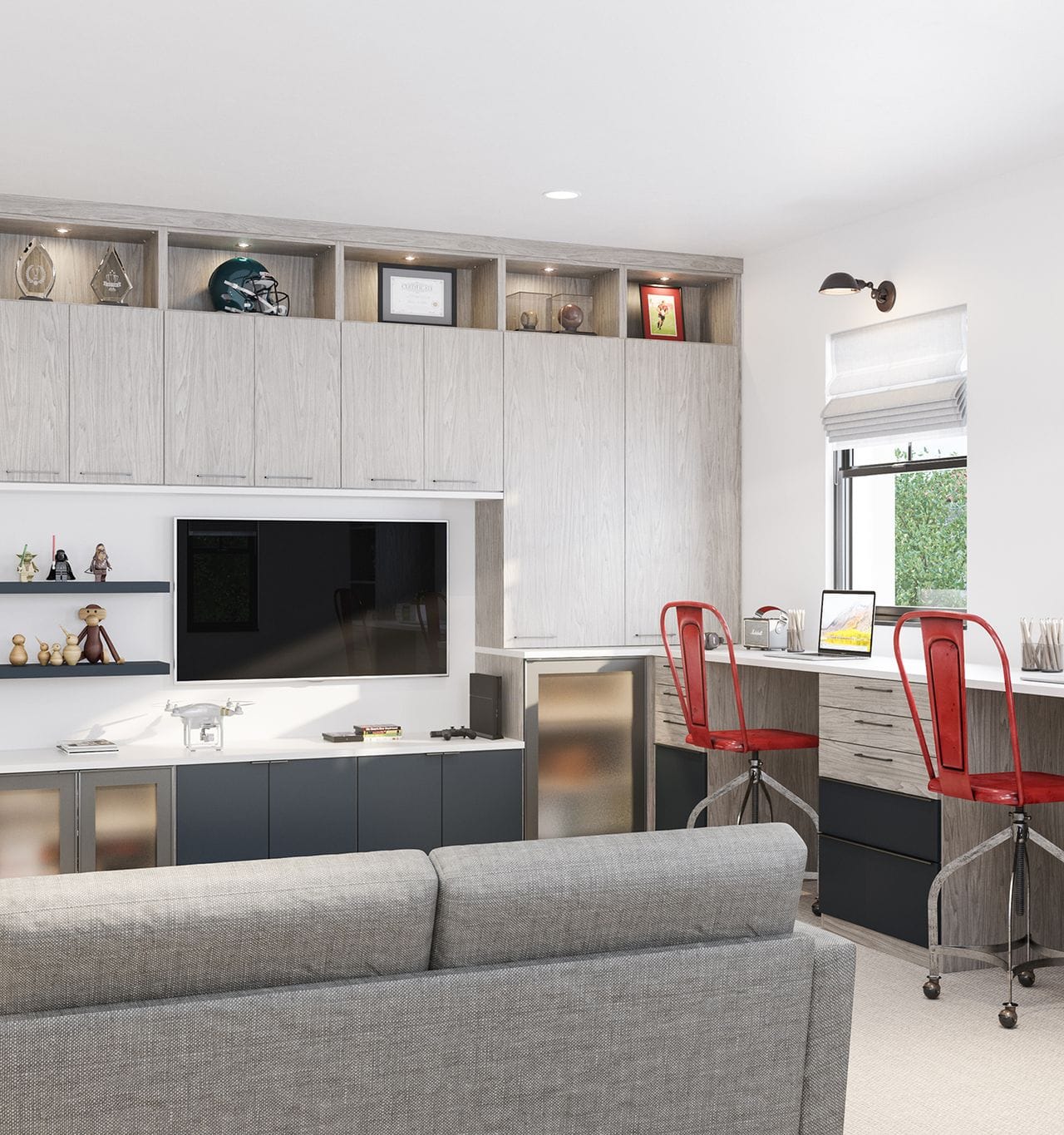Family room combined with entertainment center and workspace with cabinetry, shelves, and desk in white wood finish by California Closets