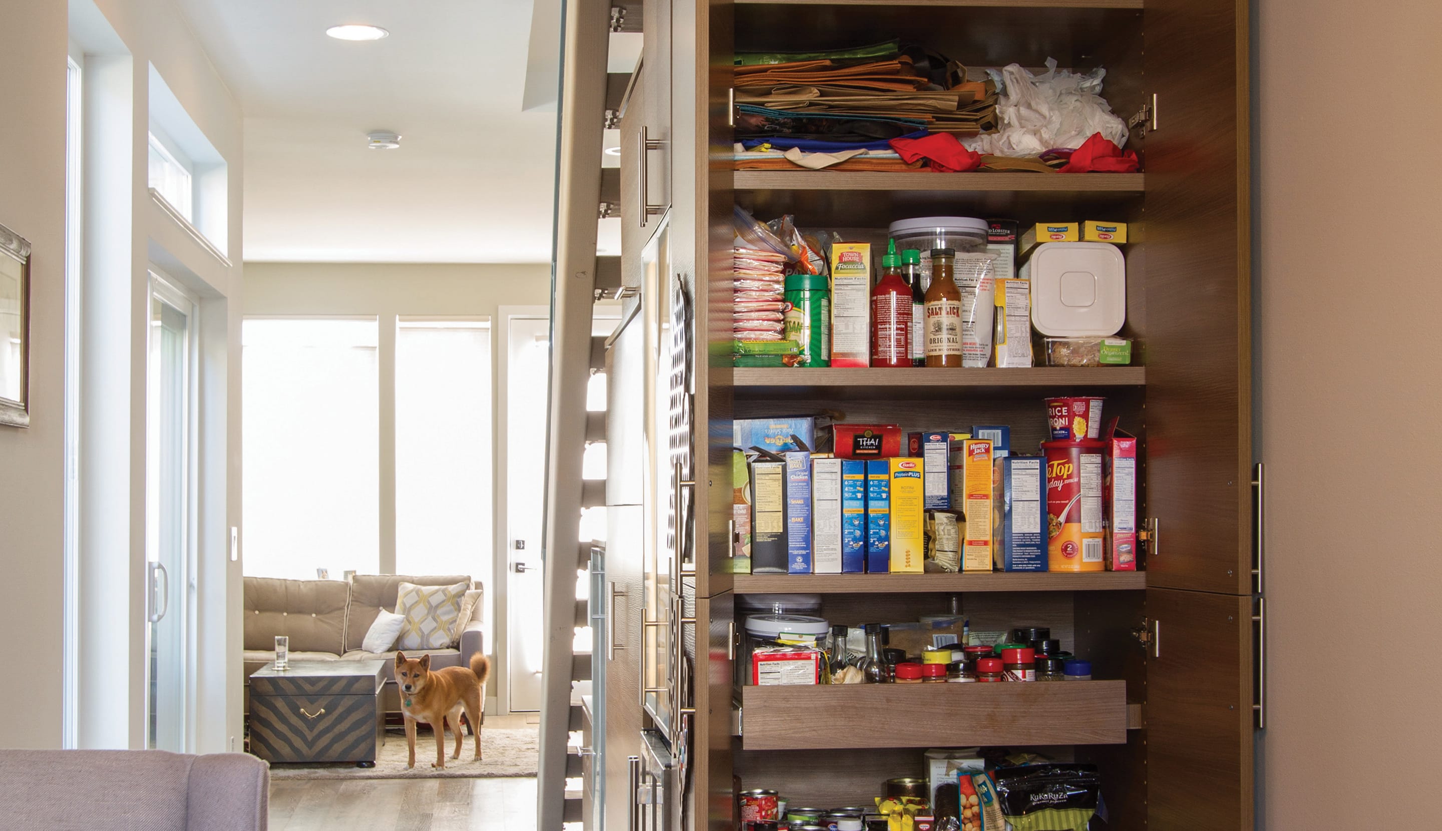 Designed and installed custom-built pantry understairs by California Closets
