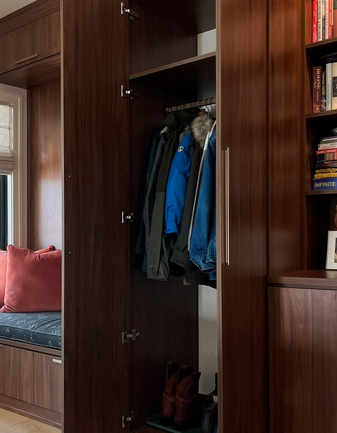 Day storage seated bench doubles as a doggy bed custom built for a home entryway from California Closets