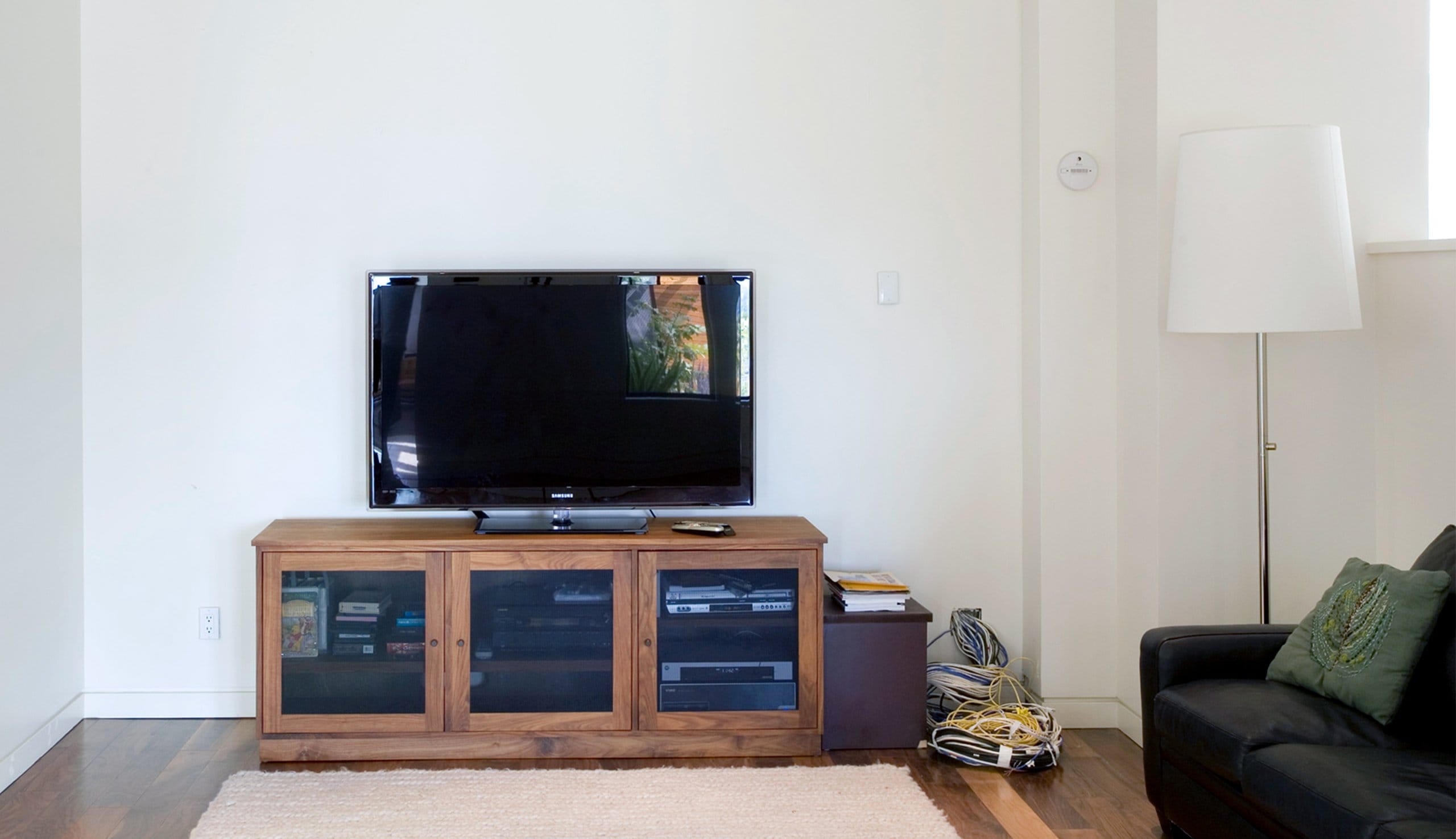 Dated entertainment center before a new installation is added in from California Closets