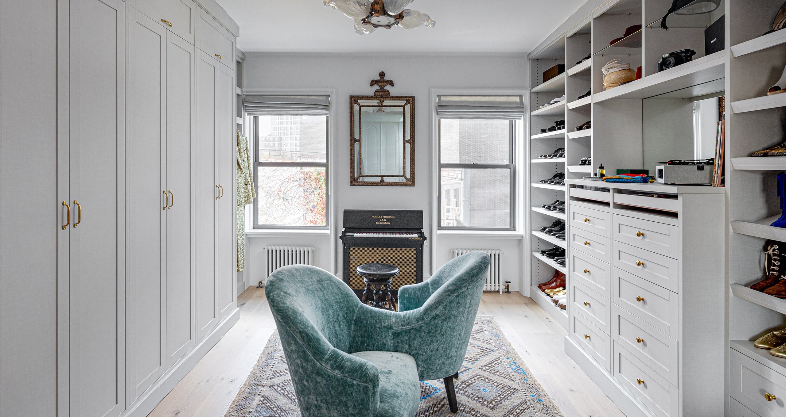 Jon Batiste Suleika Jaouad's custom walk in closet with built in dresser drawers and wardrobe armoires by California Closets