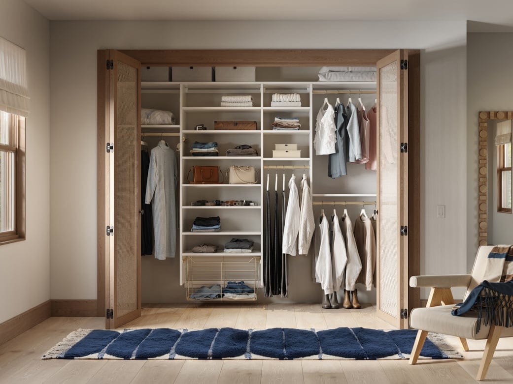 Personalized reach in closet, with open shelving, organizers for closet, long and short hanging wardrobe bars and closet organizers by California Closets